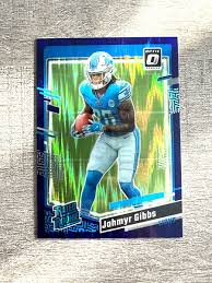 Jahmyr Gibbs Optic Purple Shock